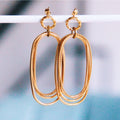 Statement oorbel ovale en gedraaide ringen